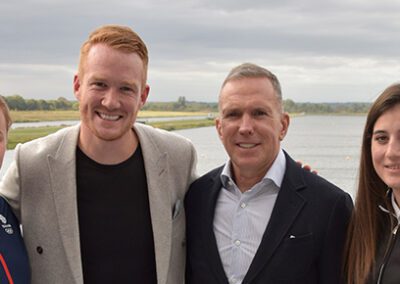 Greg Rutherford leaps to the aid of two teenage Bucks athletes